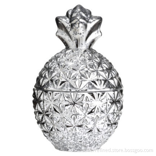 Pineapple shaped glass jar with a silver-coloured surface and a lid